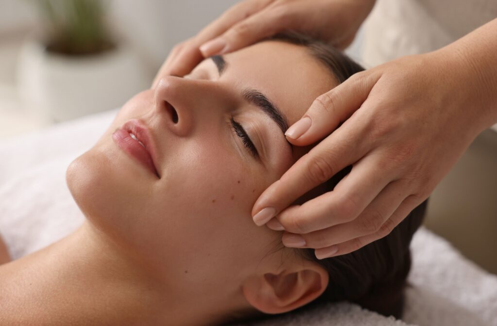 close up of a persons face who is receiving a facial from an experienced professional