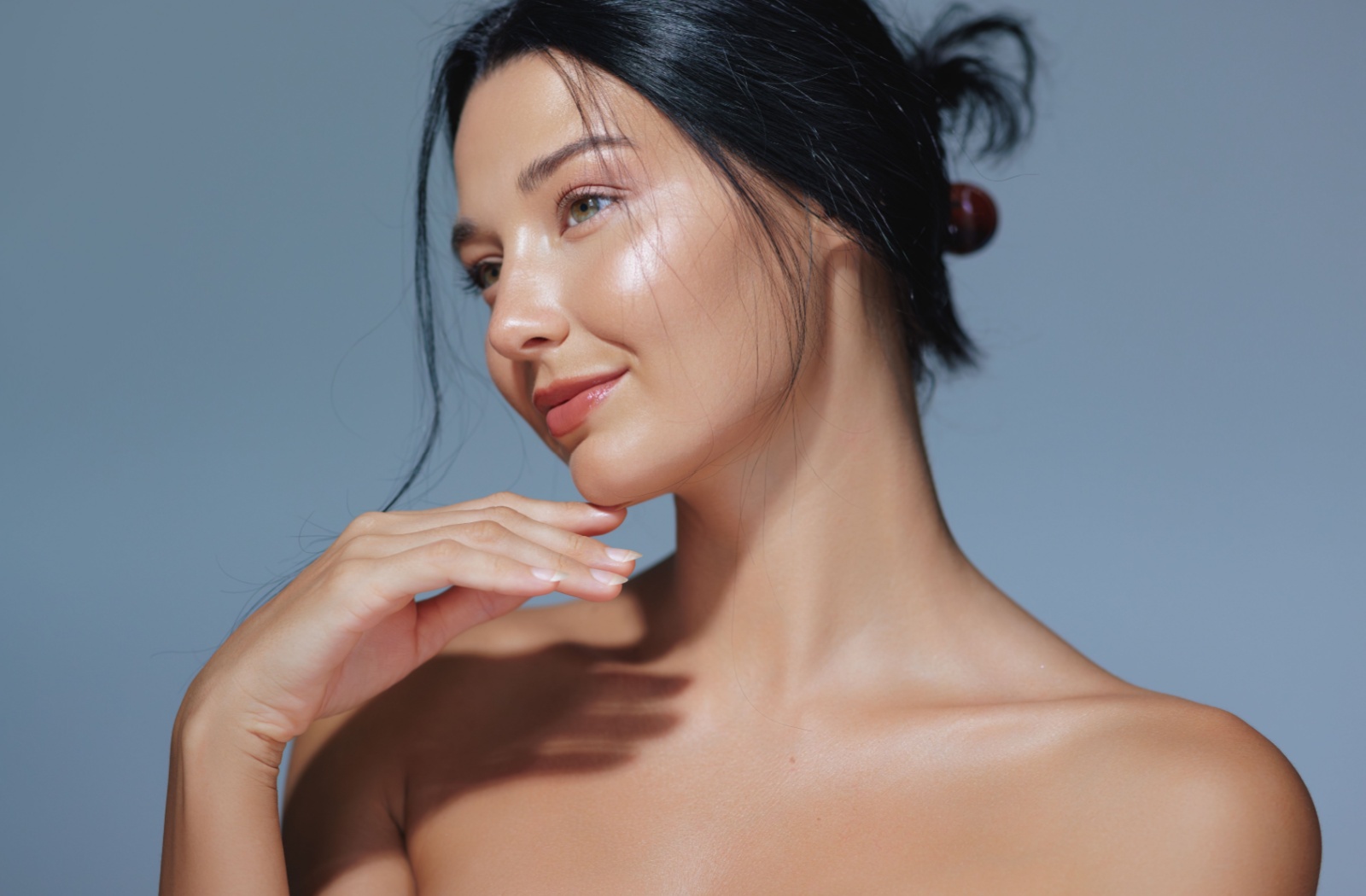 Model with clear and smooth skin looking into the distance